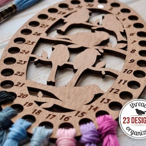 Wooden thread organizer with built-in needle keeper. A must-have tool for cross-stitch enthusiasts