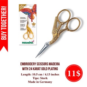 May include: Gold-plated embroidery scissors with stork-shaped tips. The scissors are 10.5 cm / 4.13 inches long and made in Germany. The product is labeled "Embroidery Scissors Madeira with 24 Karat Gold Plating".