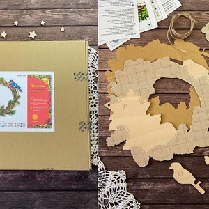 May include: A wooden craft kit for creating a wreath with birds. The kit includes a pre-cut wreath form, bird shapes, and a pattern sheet. The wreath is decorated with flowers and leaves.