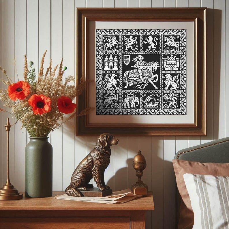 May include: A framed black and white artwork with heraldic designs and medieval imagery. The artwork is displayed above a wooden bedside table with a bronze dog statue, a vase of flowers, and a decorative lamp.