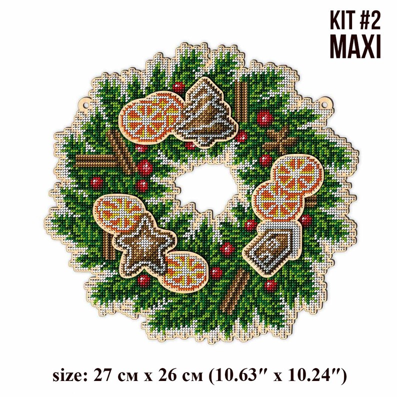 May include: A Christmas wreath with a wooden base, decorated with green pine branches, red berries, cinnamon sticks, and orange slices. The wreath also features gingerbread cookies and a small wooden house. The wreath is 10.63 inches by 10.24 inches.