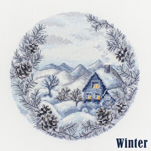 May include: A cross-stitch pattern of a winter scene with a small house with lit windows, snow-covered mountains, and pine branches with pine cones around the edges. The text "Winter" is at the bottom of the image.