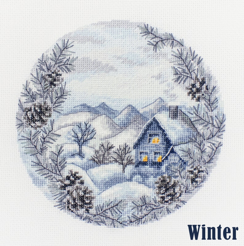 May include: A cross-stitch pattern of a winter scene with a small house with lit windows, snow-covered mountains, and pine branches with pine cones around the edges. The text "Winter" is at the bottom of the image.
