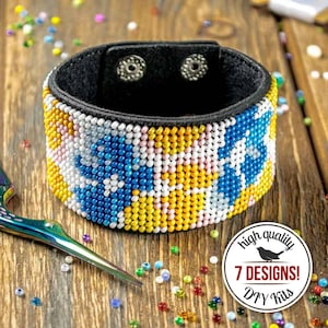 May include: A beaded cuff bracelet with a black leather backing and snap closure. The bracelet features a colorful pattern of yellow, blue, white, and pink beads. The image also includes a pair of scissors and a DIY kit logo.