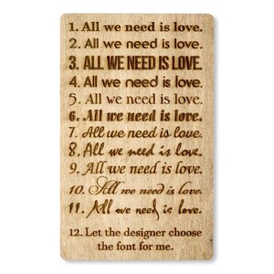 May include: A wooden sign with the text "All we need is love." repeated 11 times in different fonts. The text "Let the designer choose the font for me." is at the bottom of the sign.