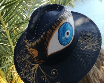 Straw hand painted hat for summer with teal "Evil Eye" and Antique Gold Details
