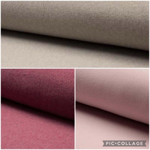 Op de afbeelding: Een collage van drie stofstalen met een zachte, viltachtige textuur. De bovenste staal is neutraal beige, de linkeronderkant is diepbordeaux en de rechteronderkant is zacht, gedempt roze. Elk stuk stof is dubbelgevouwen.