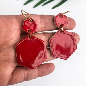 Bright red earrings on gold plated wires