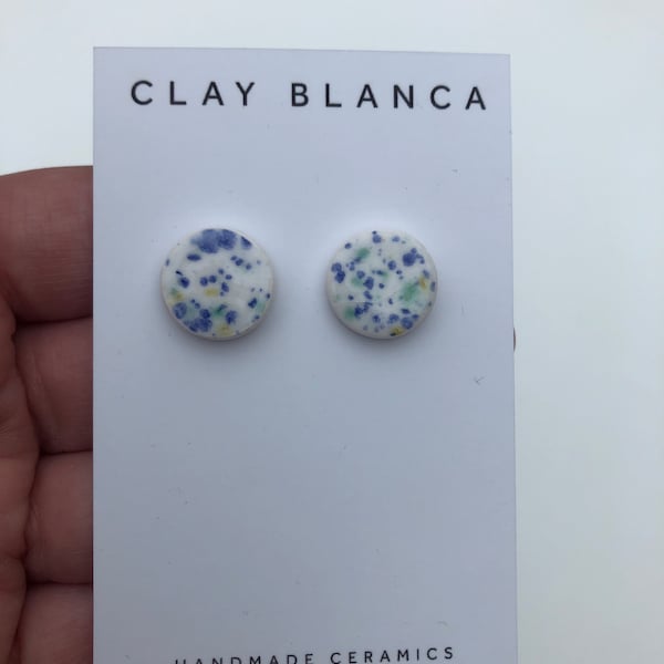 Speckled white round earrings on silver plated backs