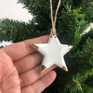 White Christmas star with gold tips, ornament