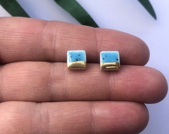 Small blue speckled square studs on sterling plated backs