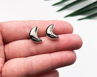 Shiny metallic moon earrings on silver plated backs