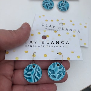 Turquoise blue dangle earrings on thin hoops