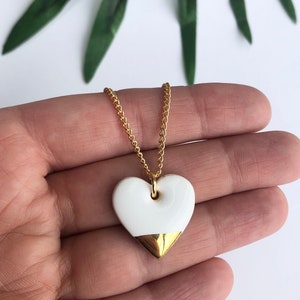 White heart pendant on gold plated chain