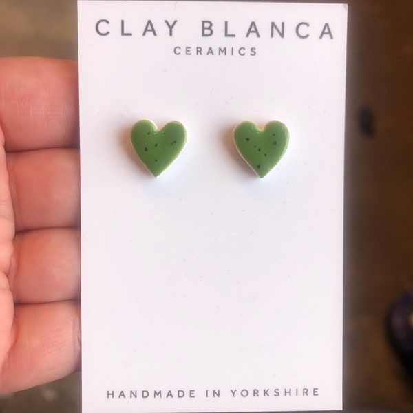 Speckled dark green heart earrings on silver plated backs