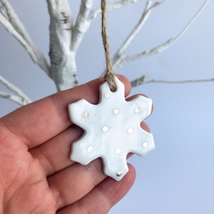 White snowflake ornament with gold dots, ornament