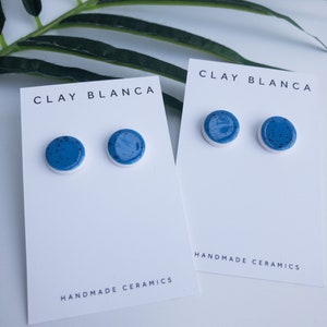 Speckled blue round earrings on silver plated backs