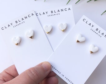 White ceramic heart earrings with gold tips