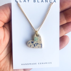 Cream speckled Heart necklace on gold plated chain