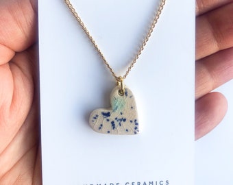 Cream speckled Heart necklace on gold plated chain