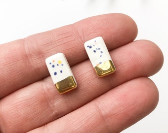 Speckled white rectangle stud earrings with gold luster