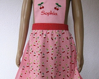 cute pink-red children's apron with cherry motif, personalized, available in sizes 92 to 122