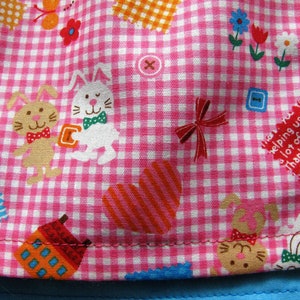 funny children's apron with name in turquoise/pink size. 86 to 122 image 4