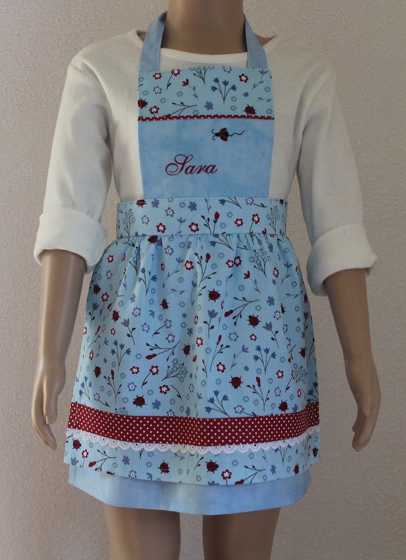 cute light blue children's apron with ladybird motif, with lace, personalized, only 1 x left in size 98 image 1