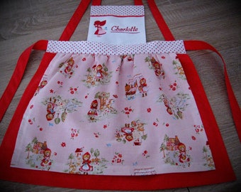 sweet, playful, pink-red children's apron with Little Red Riding Hood motifs, personalized, in size. 92 to 122