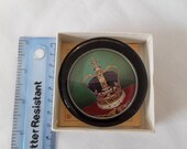 Paper weight, royal crown.