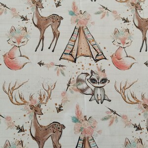 May include: A white fabric with a repeating pattern of woodland animals, including deer, foxes, and raccoons. The animals are illustrated in a whimsical style with floral accents. The pattern also includes teepees and arrows.