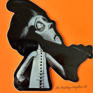 May include: A black and white illustration of a stylized figure with a long face and dark hair, wearing a light-colored coat with black buttons. The figure is set against an orange background. The text "The Painting Pumpkin Art" is in the lower right corner.