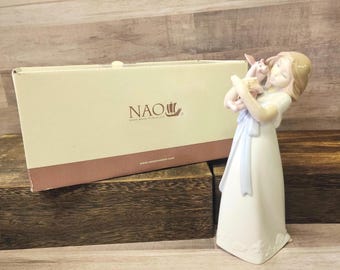 Figura vintage NAO de Lladro "Abrazos con Piglet" en perfecto estado con caja.
