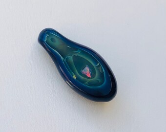 Glass pendant with encased iridescent stone