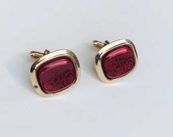 Vintage gold tone cuff links with red resin central engraved stone