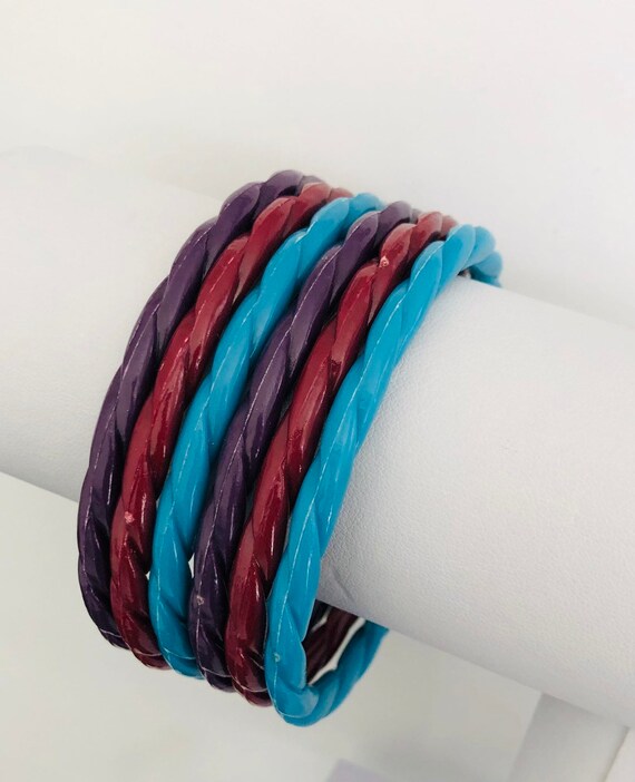 Set of six retro plastic bangles in blue, mauve an