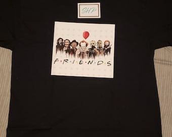 May include: Black t-shirt with a white graphic of horror movie characters, including Pennywise the clown, Freddy Krueger, Jason Voorhees, and Michael Myers. The graphic is surrounded by stars and the text "FRIENDS" is below the characters.