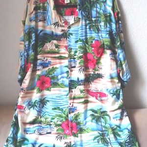 May include: A button-down shirt with a tropical print featuring palm trees, red hibiscus flowers, and classic cars in shades of blue, red, and beige. The shirt is hanging on a black hanger.