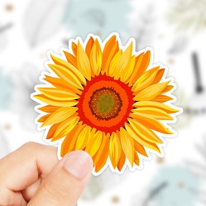 May include: A bright yellow sunflower with orange center, a popular flower for summer decor.