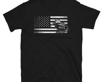 May include: Black t-shirt with a white distressed American flag design and a white silhouette of a bird with a long beak.