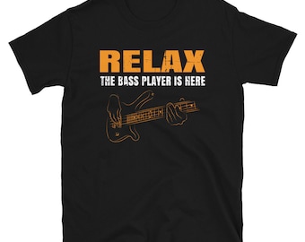 May include: Black t-shirt with the text "Relax, the bass player is here" in orange. A bass guitar is illustrated in orange.