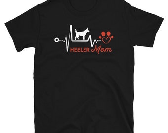 May include: Black t-shirt with a white silhouette of a dog with a red heart and paw print graphic. The text "HEELER MOM" is printed in red below the graphic.