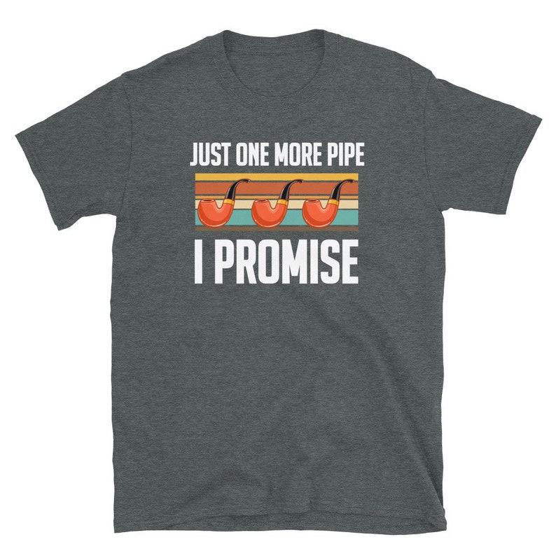 May include: A dark heather grey t-shirt with the text "Just one more pipe I promise" in white. The text is in a retro style with three red and black pipes.