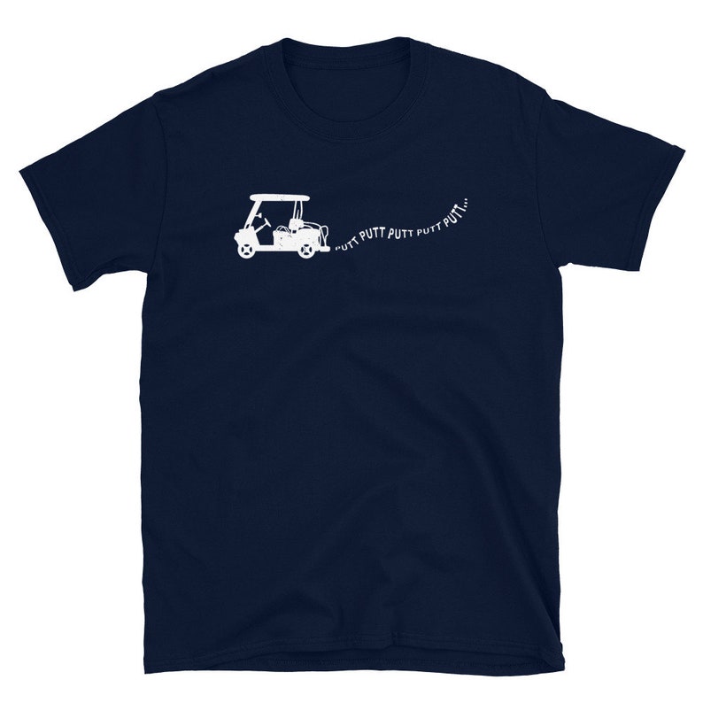 May include: A navy blue t-shirt with a white silhouette of a golf cart and the text "PUTT PUTT PUTT PUTT..." printed on the front.