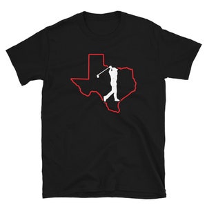 May include: Black t-shirt with a red outline of the state of Texas and a white silhouette of a golfer swinging a club.