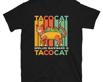 May include: Black t-shirt with a retro-style design featuring a cat dressed as a taco. The text "TACOCAT" is written in a colorful font above the cat, and the text "SPELLED BACKWARD IS TACOCAT" is written below the cat.