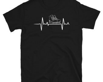 May include: Black t-shirt with a white graphic of a pair of ice skates and a heartbeat.