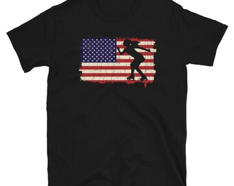 May include: Black t-shirt with a distressed American flag design and a silhouette of a figure ice skating.