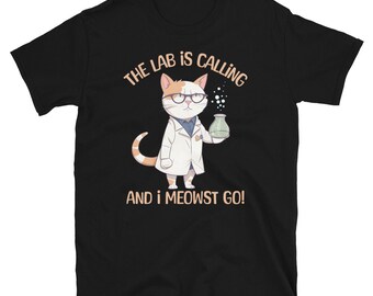 May include: Black t-shirt with a white cat wearing a lab coat and holding a beaker. The text on the shirt reads "The lab is calling and I meowst go!"