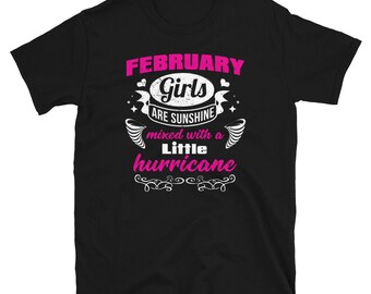 May include: Black t-shirt with white text that reads "February Girls are sunshine mixed with a little hurricane".